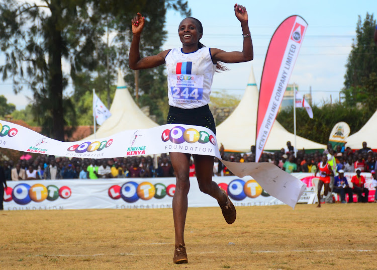 Hellen Obiri crosses the finish line to win the 10km race during the national cross country championships at the Eldoret sports club on February 23,2019