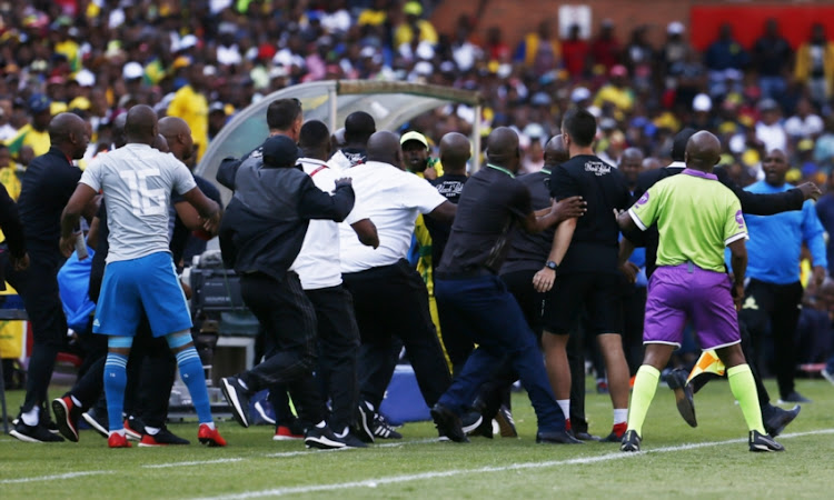 Officials clash during the Absa Premiership match between Mamelodi Sundowns and Orlando Pirates at Loftus Versfeld on November 10, 2018 in Pretoria, South Africa.