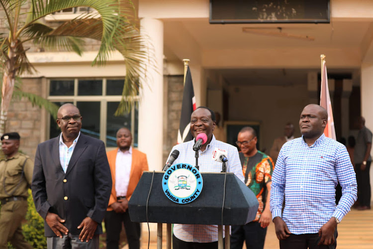 Governor Wilber Ottichilo addressing the press at the County headquarters with County Secretary Ezekiel Ayiego and DG Wilberforce Kitiezo.