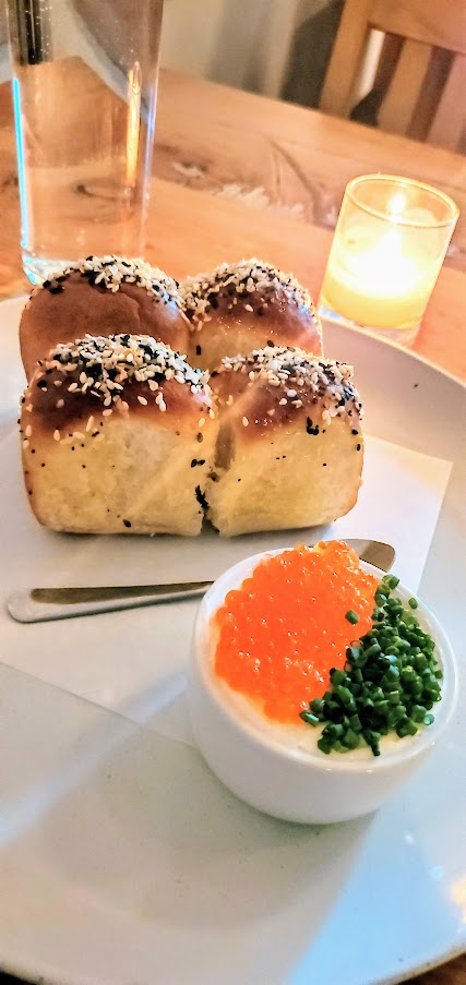 Dining at Delores PDX: Everything spiced Parker House rolls, served up with herbed cream cheese and smoked trout roe