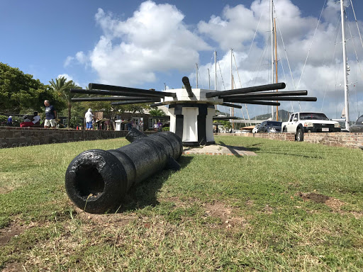 antigua-cannon-barrel.jpg - A cannon barrel lies on the ground at a marina in Antigua. 