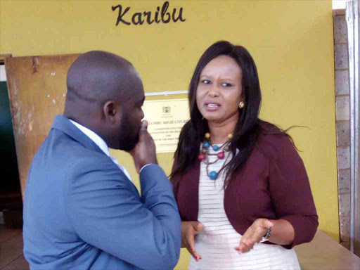 Gatundu North MP Wanjiku Wa Kibe speaking to her lawyer Jesse Oduor outside Kiambu high court. FILE