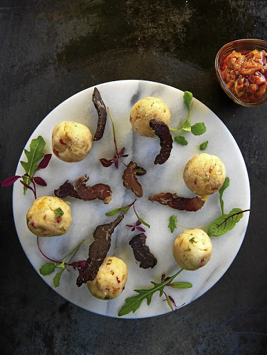 Insima balls with herbs and biltong is one of cookbook author Nompumelelo Mqwebu's modern South African dishes.