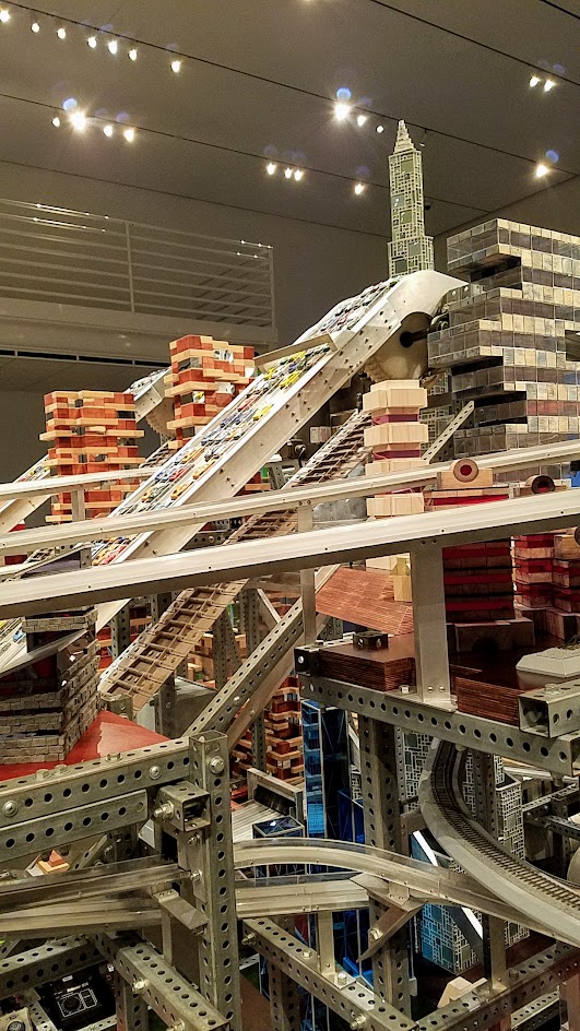 If you buy your LACMA museum admission, there is another Chris Burden exhibit you can view inside one of the building Broad Contemporary Art Museum. This is Metropolis II, also a sculpture but a kinetic one. Some of the times, it is a mini city, frozen in time with a lot of Hot Wheel Cars and Miniature trains on bridges and roads throughout the multiple levels.