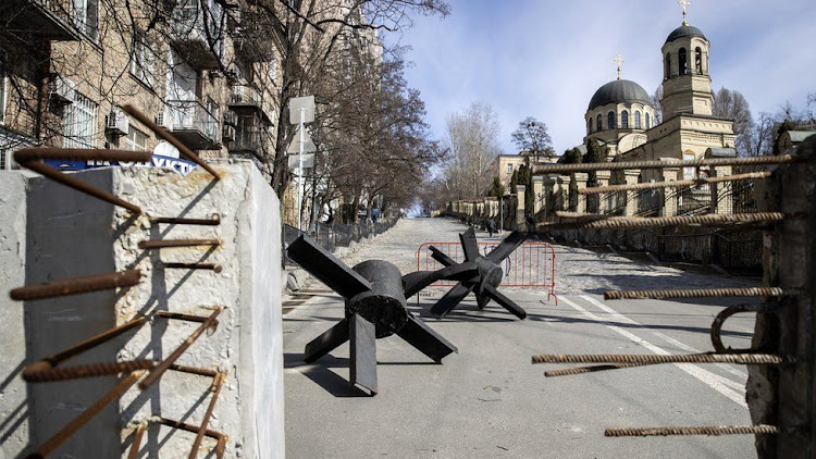 Barricades have been set up on roads in Kyiv using concrete blocks and "tank traps" from the city's museum