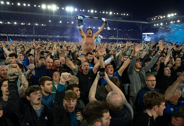 Everton fans invade the pitch after the Premier League match between Everton and Crystal Palace at Goodison Park on May 19, 2022 in Liverpool, UK.