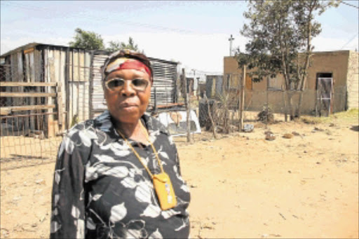 HOMELESS: Thabile Mshuqwana of Ebumnandini in Kagiso where her house used to be. PHOTO: BUSISIWE MBATHA