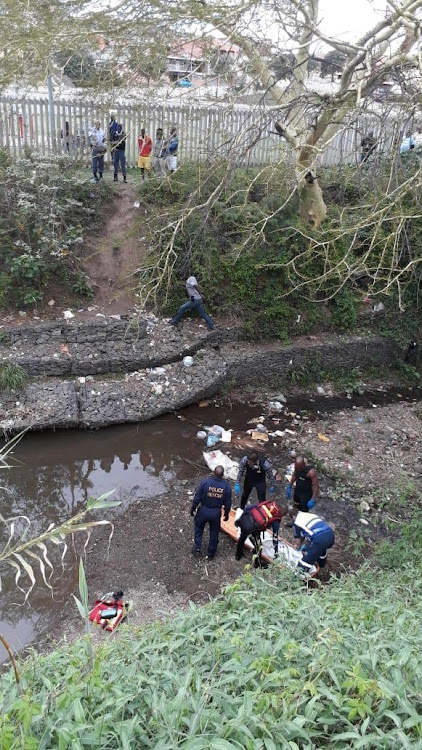 Police Search and Rescue divers recover the body of a boy who drowned while swimming in a stream in Phoenix at the weekend.