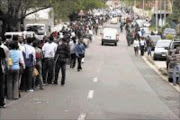 HOPEFUL: Thousands queue to collect
application forms. PIC: THULI DLAMINI. 09/09/2009. © Sowetan