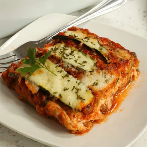 Zucchini Lasagna is a low-carbohydrate casserole that replaces the lasagna noodles with layers of zucchini noodles. A healthier alternative to classic lasagna, but with all the delicious, hearty flavor!

