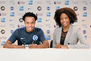 Percy Tau and his agent Mmatsatsi Sefalafala during the completion of the former Mamelodi Sundowns star's record-breaking move to English Premier League side Brighton & Hove Albion. 