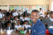 Pilot Sipho Mangesi and some of the  grade 12 pupils from four schools around Ndabakazi area in  Eastern Cape. /  SUPPLIED