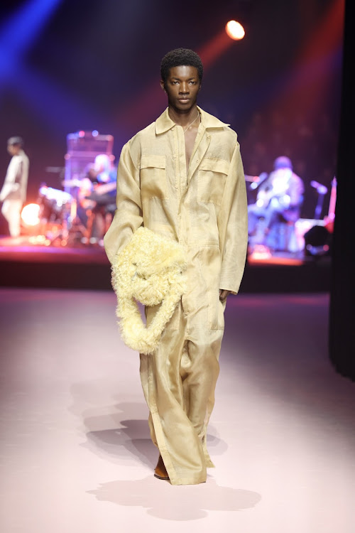 A model walks the runway at the Gucci show during Milan Fashion Week Fall/Winter 2023/24.