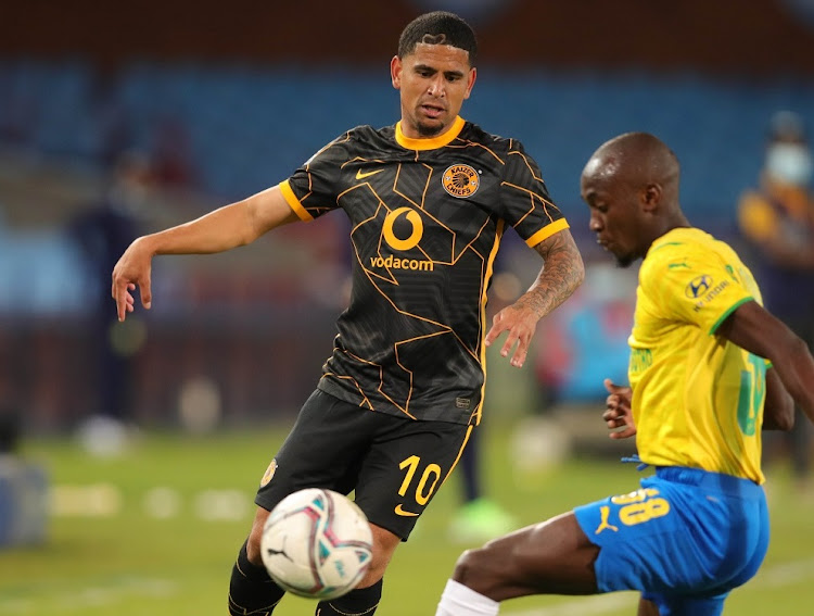 Keagan Dolly of Kaizer Chiefs is challenged by Peter Shalulile of Mamelodi Sundowns during the DStv Premiership match Loftus Versfeld in Pretoria on September 12 2021.