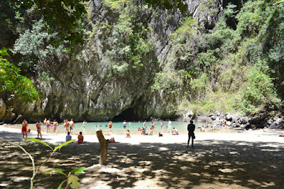 Relax at the small beach of Emerald Lagoon surrounded by steep cliffs