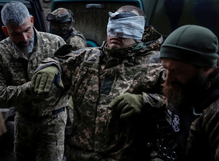 A wounded Ukrainian serviceman is moved in a pre-hospital medical aid centre, as Russia's attack on Ukraine continues, in Donetsk region, Ukraine November 22, 2022.