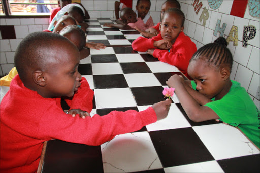 SPEAK THIS LANGUAGE? Pupils at Ganjoni Primary wait to be served lunch last March 11.Photo/Nobert Allan