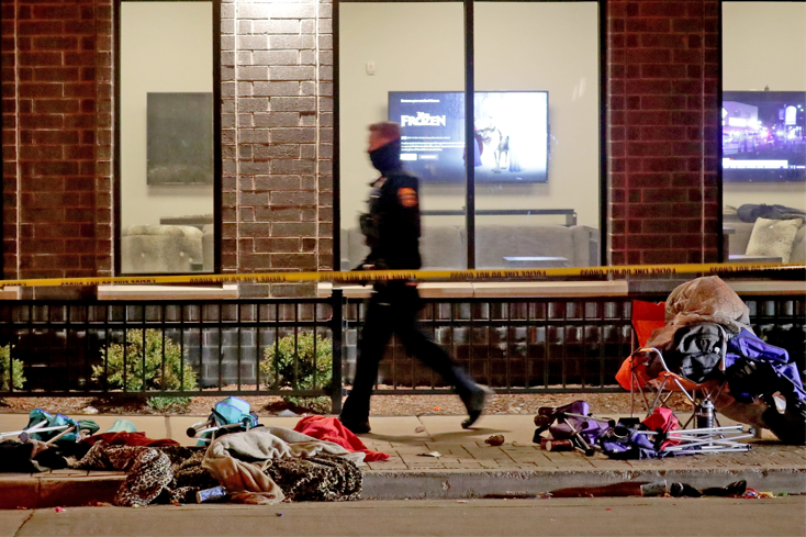 Police investigate after a vehicle ploughed through the Christmas Parade, leaving multiple people injured in Waukesha, Wisconsin, US on November 21, 2021.