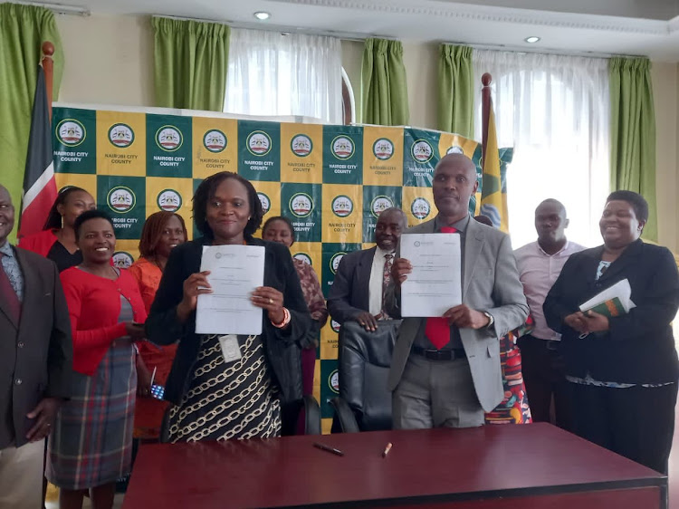 From left : Regina Mbayaki Deputy Chief of Party USAID Tumikia Mtoto Projet, and Nairobi County Secretary Jairus Musumba at City Hall on April 5, 2022