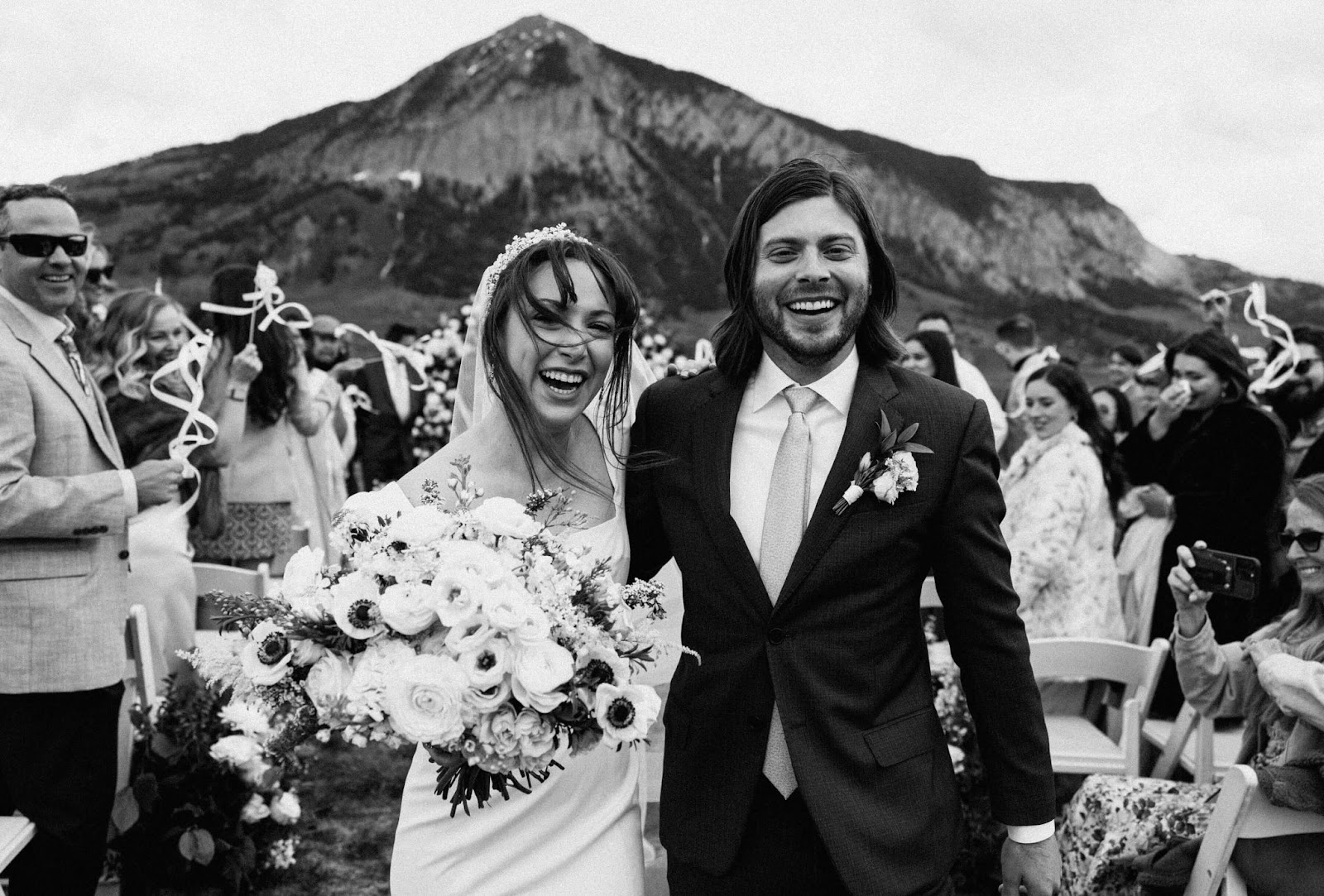 Wedding couple at their venue in Crested Butte with guests