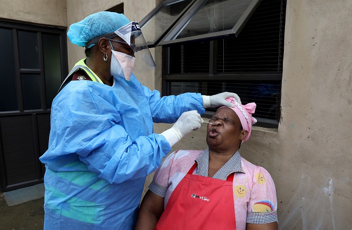 Delisiwe Khanyase,59, reacts as she is being tested for Coronavirus at home in Umlazi, South of Durban. Government is doing door-to-door screenings and testing while the country is still under lockdown so as to identify infected people before lockdown is lifted.