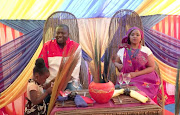 Mpho and Basil exchange vows in the presence of friends and family and are announced husband and wife.