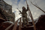 A member of the Ukrainian army in a combat position near the line of separation from Russian-backed rebels near Horlivka in the Donetsk region, Ukraine, last week.  