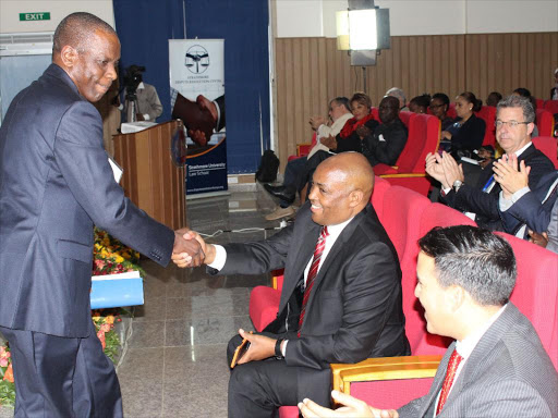 National Counter Terrorism Centre director Isaac Ochieng with CID boss Ndegwa Muhoro at Strathmore University on August 4 last year /COLLINS KWEYU