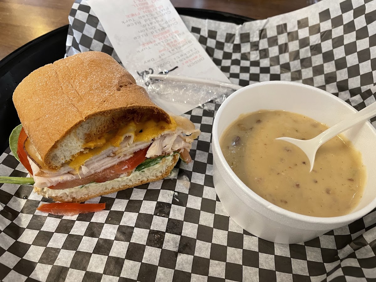 Half turkey sandwich with onion/potato/bacon soup