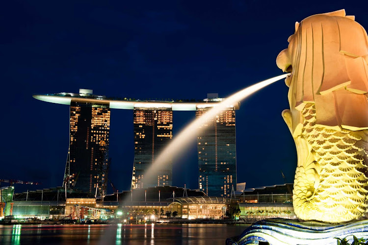 A night view of Marina Bay Sands skyline, part of Singapore's "City in a Garden" initiative. 