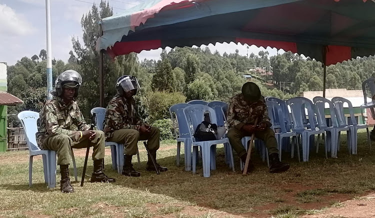 Police in riot gear guard the venue where a public participation excercise was to be conducted to collect views on an impeachment motion against Kisii Deputy Governor Robert in Gesusu, Masaba South in Kisii on Monday (IMAGE BY MAGATI OBEBO)