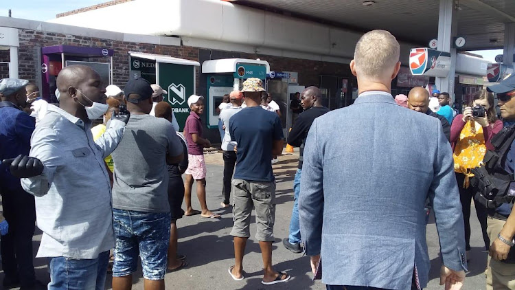 It was business a usual for Langa residents on Friday. Hordes walked the streets, went shopping and went out in numbers to withdraw money from the township's ATMs.