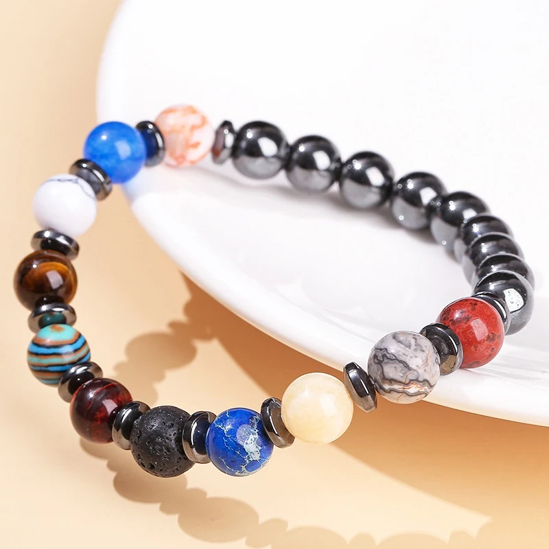 Natürliches Hämatit Planet Galaxy Armband Unisex. Fördert Ausgeglichenheit und Energie. Ein stilvolles Accessoire, das deinen Look ergänzt.