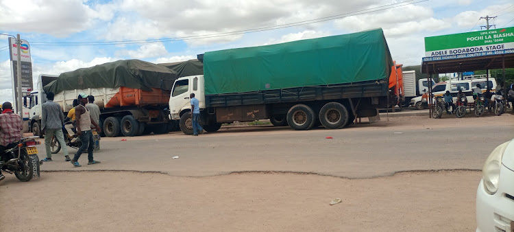 Lorries transporting goods to various parts of North Eastern counties packed in Madogo. Flash floods have destroyed the Kona Punda-Mororo section.