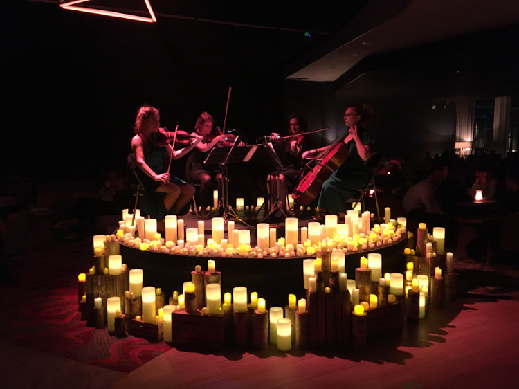 A string quartet provides some pre-dinner entertainment.