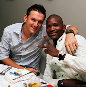 Graeme Smith and Lonwabo Tsotsobe during the South African cricket team Christmas celebration party at Umhlanga Garden Court on December 24, 2010 in Durban, South Africa.