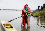 Abby Solms and Jessica Behn celebrate after winning the 2024 Dusi Canoe Marathon women's race.