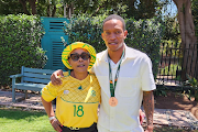 Deputy minister in the presidency Pinky Kekana and her son, Bafana Bafana defender Grant Kekana, celebrate the team's strong showing at Afcon 2023. 