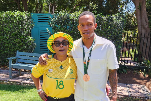 Deputy minister in the presidency Pinky Kekana and her son, Bafana Bafana defender Grant Kekana, celebrate the team's strong showing at Afcon 2023.