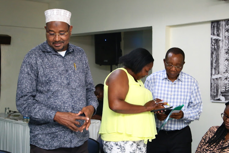 National Assembly Labour Committee chair and Bura MP Ali Wario, committee vice-chair and Bomet woman representative Joyce Korir and NSSF trustee Mark Obuya at Tamarind Hotel on Wednesday.