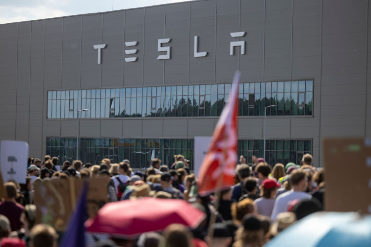 Environmental activists protest near the Tesla electric car factory on May 11 2024 close to Gruenheide, Germany.