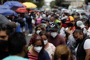 Crowds of people visit La Viga fish market during the outbreak of Covid-19, in Mexico City, Mexico, on April 1 2021. 