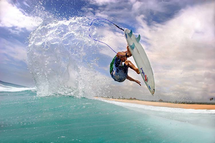 A surfer scoring some unreal surf on a remote beach break in Cabo.