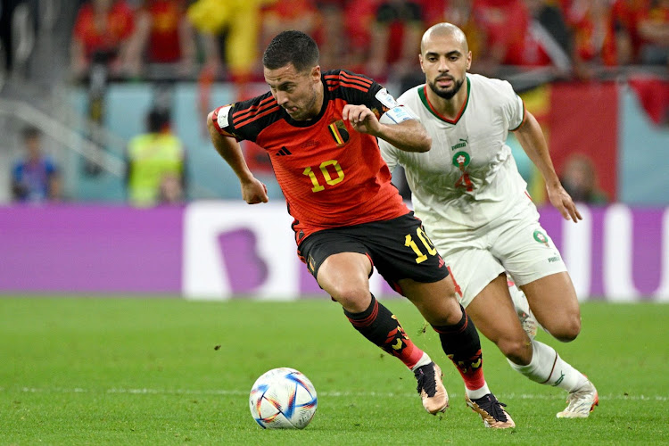 Belgium's Eden Hazard and Sofyan Amrabat of Morocco in action during the Fifa World Cup Qatar 2022 Group F match at Al Thumama Stadium on November 27 2022 in Doha.