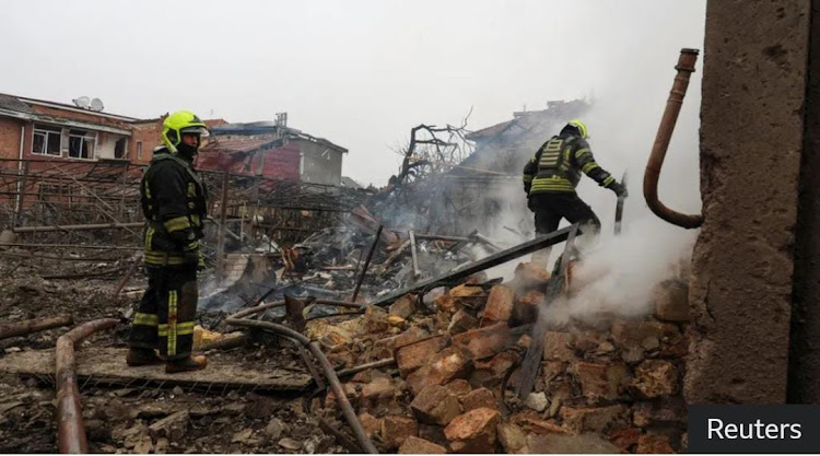 Emergency workers look through rubble after the missile strike in Odesa