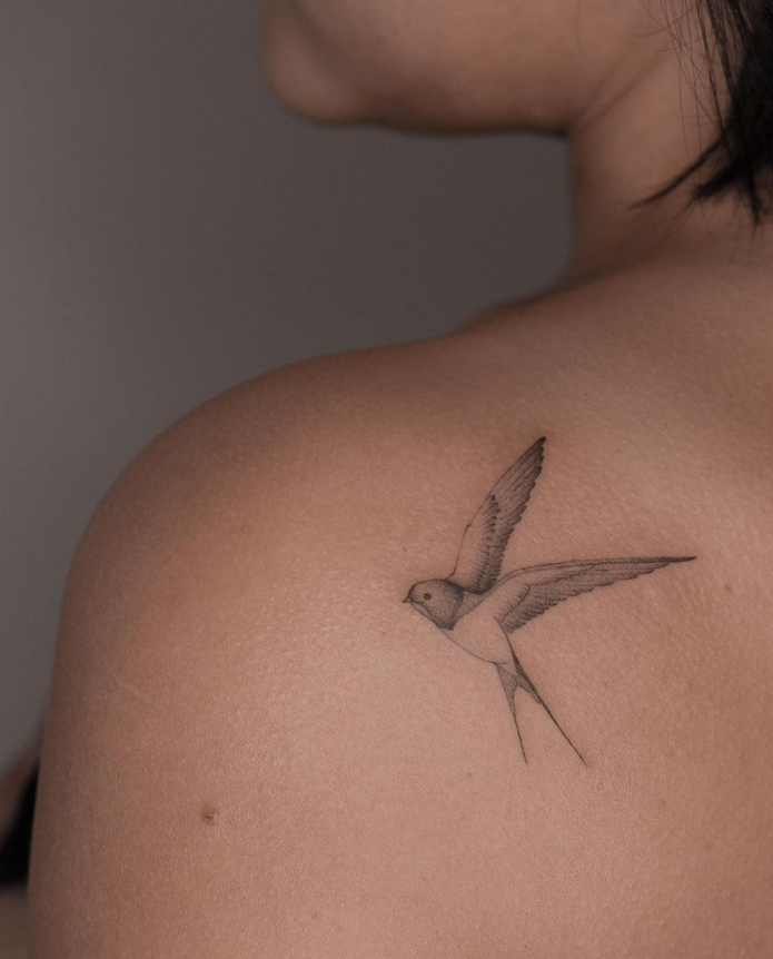 minimalistic bird tattoo 