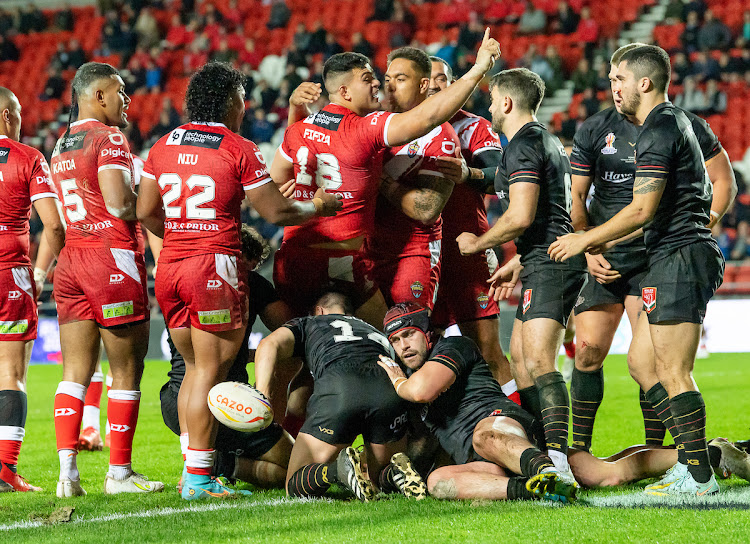 Tonga and Wales' players during their Rugby League World Cup encounter