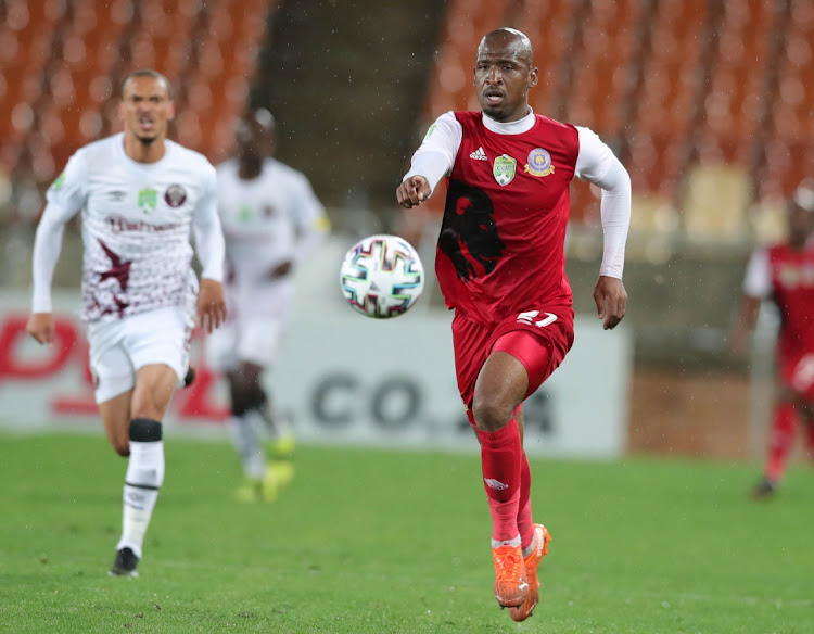 Alfred Ndengane of Tshakhuma Tsha Madzivhandila challenged by Ruzaigh Gamildien of Swallows during the 2021 Nedbank Cup last 16 match between Tshakhuma Tsha Madzivhandila and Swallows at Peter Mokaba Stadium, Polokwane, on 26 February 2021.