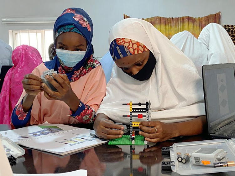 Female students assemble Legos during a robotics a "STEM" learning section of Kabara NGO in Kano, Nigeria July 25, 2021. Picture: REUTERS/SEUN SANNI