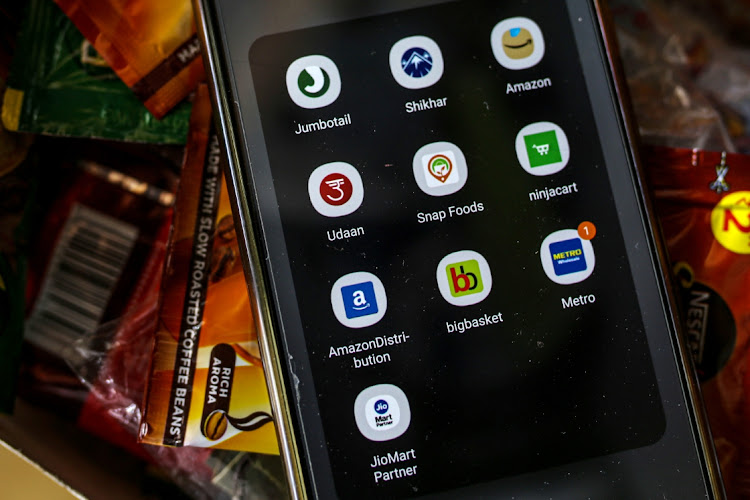 Multiple product ordering apps on a storekeeper's phone arranged at a grocery store, known as a kirana, in Bengaluru, India, in this June 21 2021 file photo. Picture: BLOOMBERG/DHIRAJ SINGH